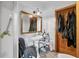 Bathroom featuring vintage sink with pedestal and a wooden door frame at 7024 Sw 93Rd Street Rd, Ocala, FL 34476