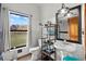 Bathroom featuring modern fixtures, a large mirror, and a picturesque outdoor view at 7024 Sw 93Rd Street Rd, Ocala, FL 34476