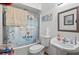 Charming bathroom with a shower-tub combo, a pedestal sink, and cute decor at 7024 Sw 93Rd Street Rd, Ocala, FL 34476