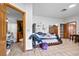 This bedroom features tile flooring, a walk-in closet, and attached bathroom at 7024 Sw 93Rd Street Rd, Ocala, FL 34476