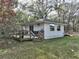 Cozy home with a charming wooden deck, perfect for outdoor relaxation and entertainment at 7024 Sw 93Rd Street Rd, Ocala, FL 34476