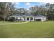 Charming single-story house with manicured lawn and landscaping enhancing curb appeal at 7024 Sw 93Rd Street Rd, Ocala, FL 34476