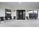 Welcoming front porch with ample seating and stylish light fixtures enhancing the entrance at 7024 Sw 93Rd Street Rd, Ocala, FL 34476