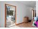 Hallway view to backyard pool area, featuring natural light, and tiled floors at 7024 Sw 93Rd Street Rd, Ocala, FL 34476