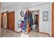 Hallway featuring wood barn door, closet, and access to a bathroom at 7024 Sw 93Rd Street Rd, Ocala, FL 34476