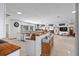 Spacious open floor plan featuring a kitchen with wood countertops and modern appliances and a breakfast bar at 7024 Sw 93Rd Street Rd, Ocala, FL 34476