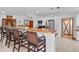 Modern kitchen with a wooden breakfast bar and stainless steel appliances, perfect for entertaining at 7024 Sw 93Rd Street Rd, Ocala, FL 34476