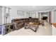 The living room has a large leather sectional, wood tables, and an open layout at 7024 Sw 93Rd Street Rd, Ocala, FL 34476