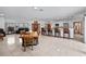 Spacious living area with a dining table, breakfast bar, and comfortable seating arrangements at 7024 Sw 93Rd Street Rd, Ocala, FL 34476