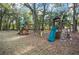 Residential playground equipment set with swings, slides, and climbing structure at 7024 Sw 93Rd Street Rd, Ocala, FL 34476