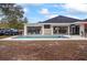Backyard pool with outdoor seating, bar access, ice cold drink fridge, and room for activities at 7024 Sw 93Rd Street Rd, Ocala, FL 34476