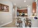 Modern kitchen with breakfast bar and stainless steel appliances at 791 Aldenham Ln, Ormond Beach, FL 32174