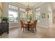 Charming breakfast nook with a round table and chairs near kitchen at 990 Downshire Ln, Ormond Beach, FL 32174