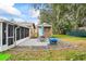 Private backyard patio with seating area and storage shed at 1031 Calle Grande St, Ormond Beach, FL 32174