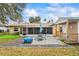 Large backyard with patio, shed, and fire pit at 1031 Calle Grande St, Ormond Beach, FL 32174