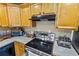 This kitchen features a gas range, ample counter space, and wood cabinets at 1031 Calle Grande St, Ormond Beach, FL 32174