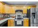 Stainless steel appliances and light wood cabinets highlight this kitchen at 1031 Calle Grande St, Ormond Beach, FL 32174