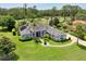 One-story house with solar panels and a circular driveway at 1068 Hampstead Ln, Ormond Beach, FL 32174