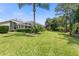 Spacious backyard with lush lawn and screened enclosure at 1068 Hampstead Ln, Ormond Beach, FL 32174