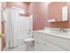 Bathroom with shower/tub combo, toilet, and vanity with white cabinets at 1068 Hampstead Ln, Ormond Beach, FL 32174