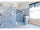 Walk in shower with tiled walls and seating at 1068 Hampstead Ln, Ormond Beach, FL 32174