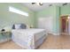 Bedroom with tiled floors, double door closet and ceiling fan at 1068 Hampstead Ln, Ormond Beach, FL 32174