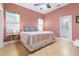 Spacious bedroom with king-size bed and en-suite bathroom access at 1068 Hampstead Ln, Ormond Beach, FL 32174