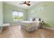 Bright bedroom with tiled floors and ceiling fan at 1068 Hampstead Ln, Ormond Beach, FL 32174