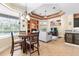 Casual breakfast nook with a round table and chairs, near the kitchen at 1068 Hampstead Ln, Ormond Beach, FL 32174