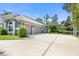 Three car garage with circular driveway at 1068 Hampstead Ln, Ormond Beach, FL 32174