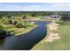 Aerial view of a golf course and clubhouse at 1068 Hampstead Ln, Ormond Beach, FL 32174