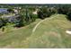 Aerial view of a golf course next to a residential area at 1068 Hampstead Ln, Ormond Beach, FL 32174