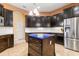 Modern kitchen featuring stainless steel appliances and a blue quartz island at 1068 Hampstead Ln, Ormond Beach, FL 32174