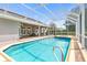 Inviting pool and spa with screened enclosure at 1068 Hampstead Ln, Ormond Beach, FL 32174