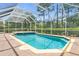 Inviting screened pool and spa with ample patio space at 1068 Hampstead Ln, Ormond Beach, FL 32174