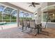 Brick patio with table and chairs, overlooking the pool at 1068 Hampstead Ln, Ormond Beach, FL 32174