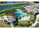 Community pool and clubhouse with lake view at 1068 Hampstead Ln, Ormond Beach, FL 32174