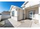 Front entryway with a glass door and concrete patio area at 11977 Se 91St Cir, Summerfield, FL 34491