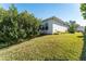 House exterior showcasing a side view and landscaping at 11977 Se 91St Cir, Summerfield, FL 34491