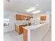 Kitchen with wood cabinets and an island at 11977 Se 91St Cir, Summerfield, FL 34491