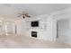 Living room with built-in shelving and fireplace at 11977 Se 91St Cir, Summerfield, FL 34491