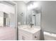 Half bathroom with a modern vanity, mirror, and decorative hardware at 211 Oak Lane Loop, Ocala, FL 34472