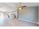 Bright living room showcasing hardwood floors, a modern ceiling fan and an open concept layout at 211 Oak Lane Loop, Ocala, FL 34472