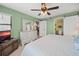 King bedroom with barn door to bathroom and ocean view at 3100 Ocean Shore Blvd # 5020, Ormond Beach, FL 32176