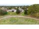 Aerial view of house near golf course and walking path at 4546 Nottoway Dr, Leesburg, FL 34748