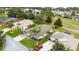 Aerial view of a single Gathering home with a red truck in the driveway at 4546 Nottoway Dr, Leesburg, FL 34748