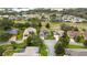 Aerial view of a residential area with homes and a lush green golf course at 4546 Nottoway Dr, Leesburg, FL 34748