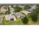 Aerial view of a residential neighborhood with houses and roads at 4546 Nottoway Dr, Leesburg, FL 34748