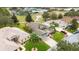 Aerial view showcasing a house's location within a residential community at 4546 Nottoway Dr, Leesburg, FL 34748