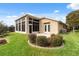 Home exterior with sunroom and patio at 4546 Nottoway Dr, Leesburg, FL 34748